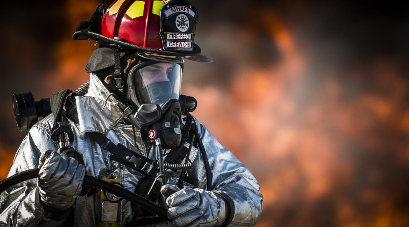 shallow focus photography of fireman